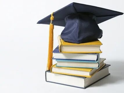 Graduation cap on books